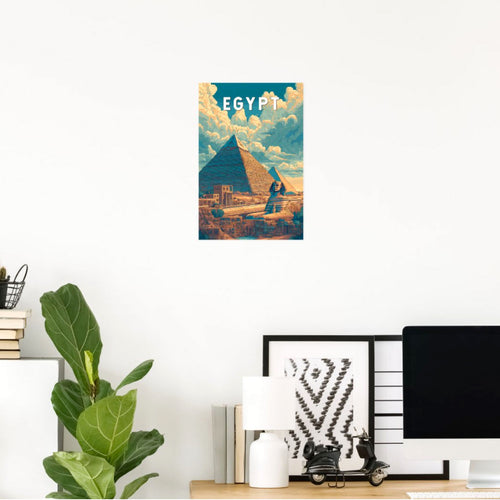 VERTICAL EGYPT TRAVEL POSTER FEATURING THE GREAT PYRAMID OF GIZA AND SPHINX WITH A SUNBEAM, DISPLAYED ABOVE A MODERN DESK ON A WHITE WALL.