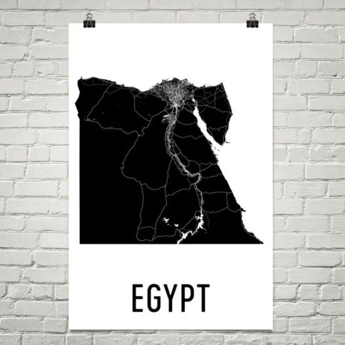 MINIMALIST EGYPT MAP POSTER FEATURING A BLACK SILHOUETTE MAP WITH ROADS AND THE NILE RIVER, DISPLAYED ON A WHITE BRICK WALL.