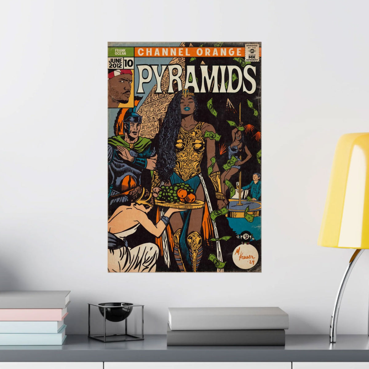 VINTAGE-STYLE PYRAMID ART POSTER FEATURING “CHANNEL ORANGE PYRAMIDS” TEXT, DISPLAYED ON A LIGHT GRAY WALL ABOVE BOOKS AND A YELLOW LAMP.