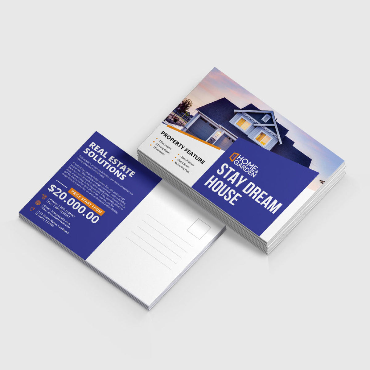 STACK OF CUSTOM PRINTED REAL ESTATE MARKETING POSTCARDS FEATURING A BLUE AND WHITE PROPERTY PROMOTION DESIGN ON A LIGHT GRAY BACKGROUND.