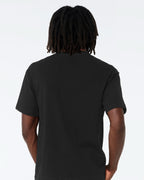 MAN WEARING BLACK T SHIRT FROM BACK SIDE VIEW.