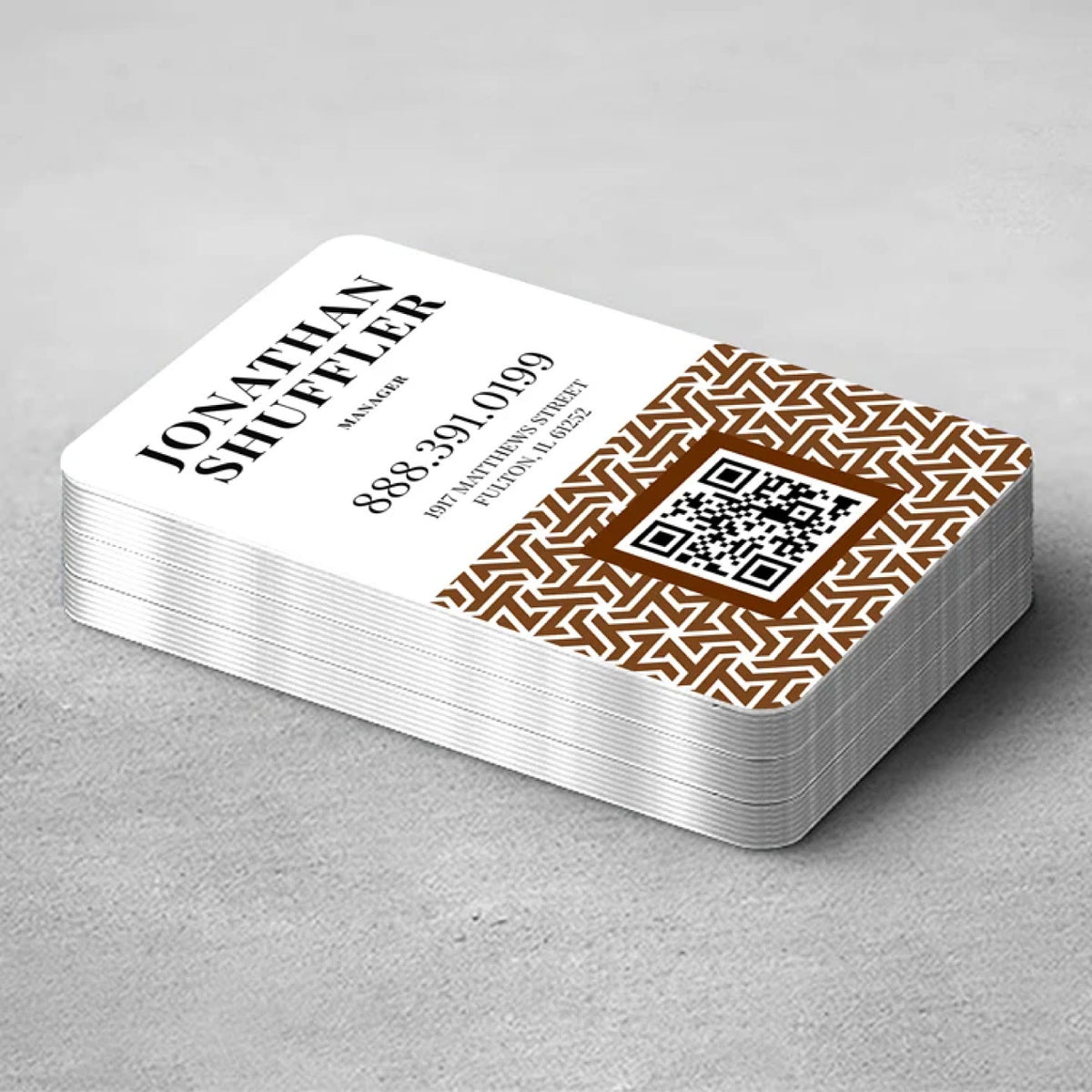 STACK OF CUSTOM ALUMINUM BUSINESS CARDS WITH ROUNDED CORNERS, METALLIC EDGES, CONTACT INFORMATION, GEOMETRIC GRAPHICS, AND A QR CODE.