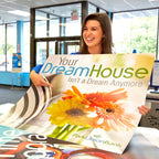 CUSTOM PRINTED STYRENE SIGN FEATURING A PARK UNION BANK HOME PROMOTION WITH COLORFUL FLORAL GRAPHICS, HELD BY A WOMAN IN A BANK LOBBY.