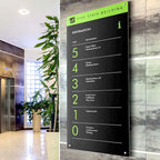 CUSTOM PRINTED ACM DIRECTORY SIGN FEATURING FIVE STAIR BUILDING INFORMATION WITH GREEN AND WHITE GRAPHICS, MOUNTED ON A GRAY TILED WALL IN A MODERN LOBBY.